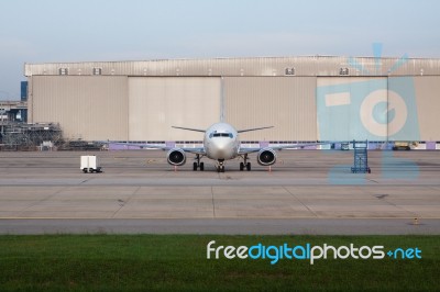 Passenger Jet Plane Parking On Taxi Way Stock Photo