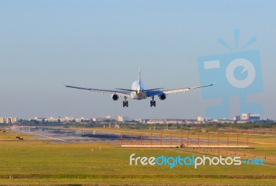 Passenger Plane Appoaching To Landing On Airport Runways Stock Photo