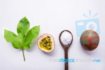 Passion Fruit And Leave With Salt In Wooden Spoon On Wooden Whit… Stock Photo