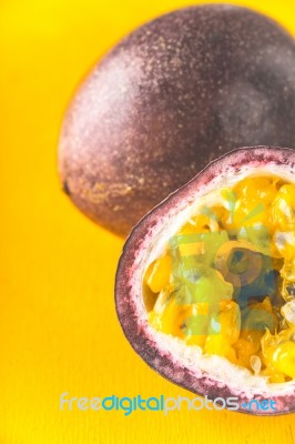 Passion Fruit On The Yellow Background Vertical Stock Photo