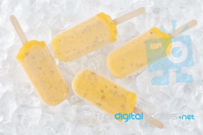 Passion Fruit  Popsicle Yummy Fresh Summer Fruit Sweet Dessert Wood Teak White Stock Photo