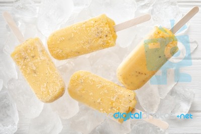 Passion Fruit  Popsicle Yummy Fresh Summer Fruit Sweet Dessert Wood Teak White Stock Photo