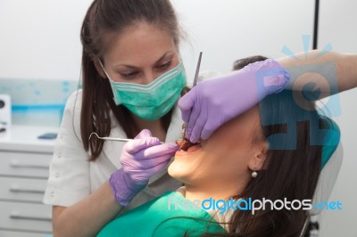 Patient And Dentist In The Dental Practice Stock Photo