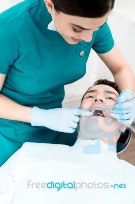 Patient Getting Dental Checkup Stock Photo