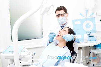 Patient Getting Treated By Orthodontist Stock Photo