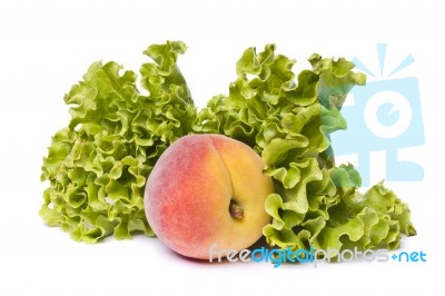 Peach With Lettuce On White Stock Photo