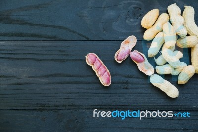 Peanuts On Wooden Stock Photo