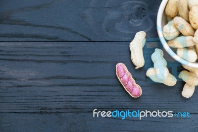 Peanuts On Wooden Background Stock Photo