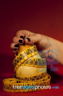 Pear With Measuring Tape Stock Photo