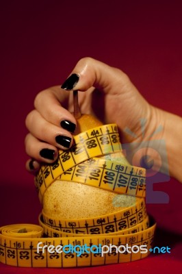 Pear With Measuring Tape Stock Photo