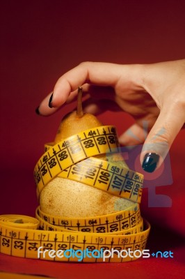 Pear With Measuring Tape Stock Photo