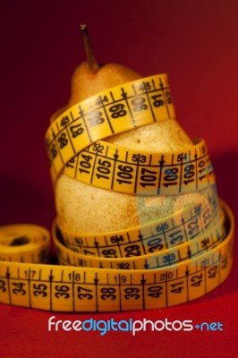 Pear With Measuring Tape Stock Photo