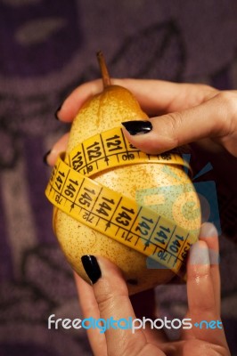 Pear With Measuring Tape Stock Photo