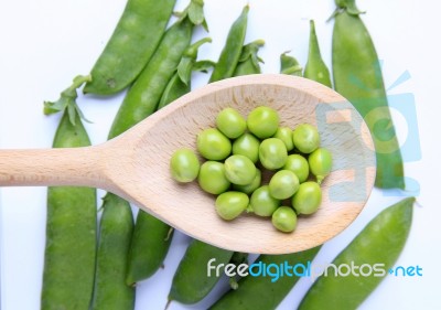 Peas On Wooden Spoon Stock Photo