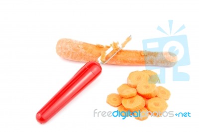 Peeling A Carrot With Peeler On White Stock Photo