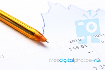 Pen And Financial Report Stock Photo