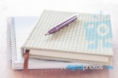 Pen And Two Of Notebooks On Wooden Table Stock Photo