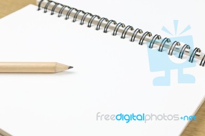 Pencil And Blank Opened Notebook Stock Photo