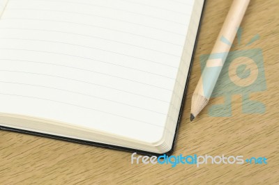 Pencil And Blank Opened Notebook Stock Photo