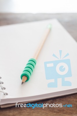 Pencil On Open Blank Notebook Stock Photo