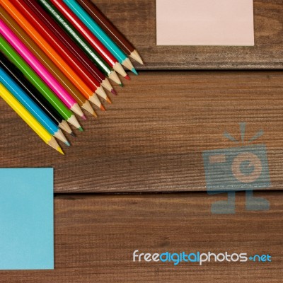 Pencils And Note Papers On A Background Of Dark Wood Tables With… Stock Photo