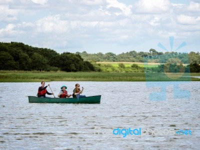 People Canoeing On The River Alde Stock Photo