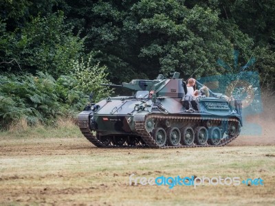 People Enjoying A Ride In An Armoured Car At Dunsfold Airfield Stock Photo