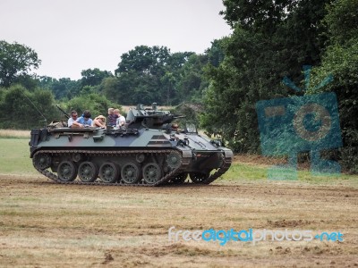 People Enjoying A Ride In An Armoured Car At Dunsfold Airfield Stock Photo