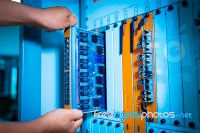 People Fix Core Switch In Network Room Stock Photo