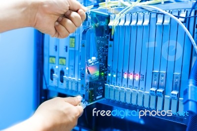 People Fix Core Switch In Network Room Stock Photo