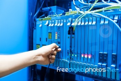 People Fix Core Switch In Network Room Stock Photo