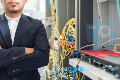 People Fix Core Switch In Network Room Stock Photo