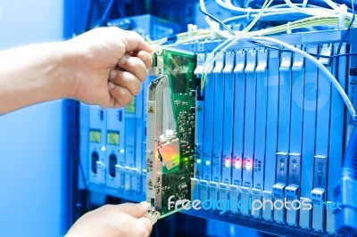 People Fix Core Switch In Network Room Stock Photo