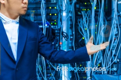 People Fix Core Switch In Network Room Stock Photo