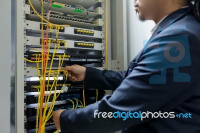 People Fix Node Fiber Optic In Network Room Stock Photo