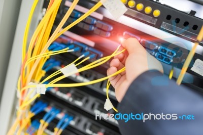 People Fix Node Fiber Optic In Network Room Stock Photo