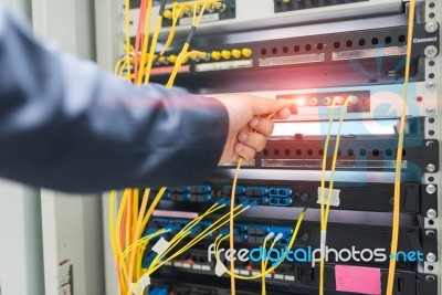 People Fix Node Fiber Optic In Network Room Stock Photo