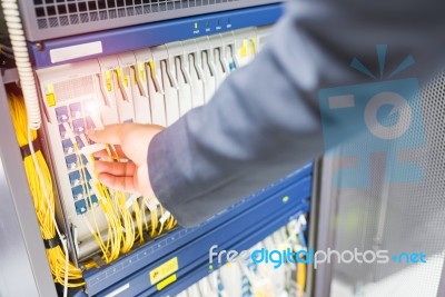 People Fix Node Fiber Optic In Network Room Stock Photo