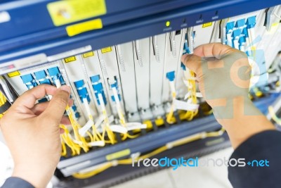 People Fix Node Fiber Optic In Network Room Stock Photo