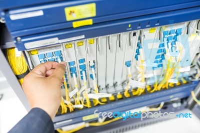 People Fix Node Fiber Optic In Network Room Stock Photo