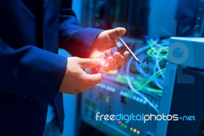 People Fix Node Fiber Optic In Network Room Stock Photo