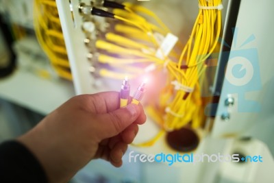 People Fix Node Fiber Optic In Network Room Stock Photo