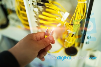 People Fix Node Fiber Optic In Network Room Stock Photo