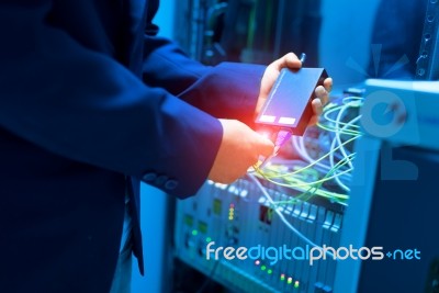 People Fix Node Fiber Optic In Network Room Stock Photo