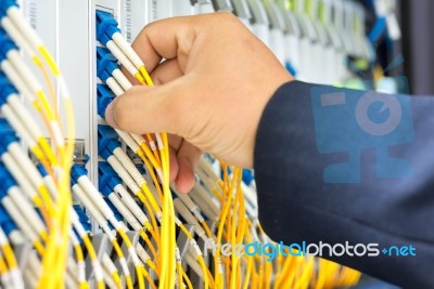 People Fix Node Fiber Optic In Network Room Stock Photo