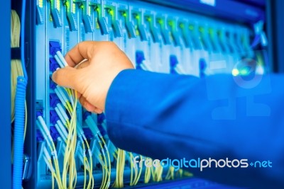 People Fix Node Fiber Optic In Network Room Stock Photo