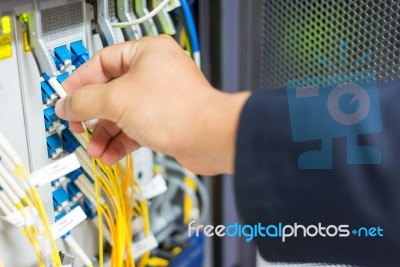 People Fix Node Fiber Optic In Network Room Stock Photo