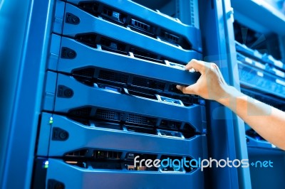 People Fix Server Network In Data Room Stock Photo