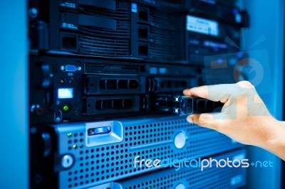 People Fix Server Network In Data Room Stock Photo