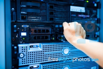 People Fix Server Network In Data Room Stock Photo